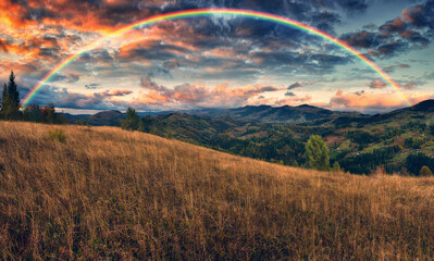 Rainbow over the Mountains. autumn morning in the Carpathians. Nature of Ukraine