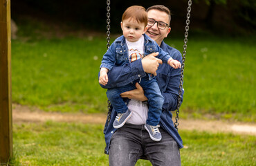 Father with child on swing