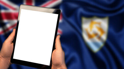 Man hold tablet phone pc gadget with white blank screen, copy space for text, image or message. Flag of Anguilla country on background. Technology, information, business
