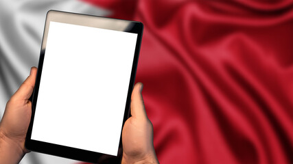 Man hold tablet phone pc gadget with white blank screen, copy space for text, image or message. Flag of Bahrain country on background. Technology, information, business

