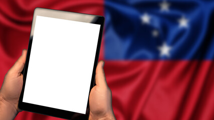 Man hold tablet phone pc gadget with white blank screen, copy space for text, image or message. Flag of Samoa country on background. Technology, information, business

