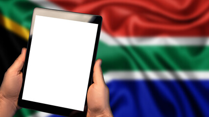 Man hold tablet phone pc gadget with white blank screen, copy space for text, image or message. Flag of South Africa country on background. Technology, information, business

