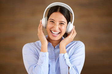 Happy professional woman, headphones and listen to music in portrait, break at work with podcast and mockup space. Happiness, stress relief and audio streaming online, female worker and wireless tech