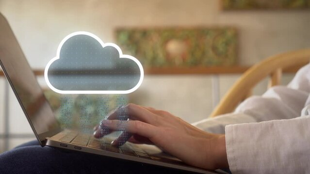 Professional woman working from home using her laptop with data being synchronized  to online storage, IOT network connectivity for devices. Blockchain, Cloud storage, Data center analytics 4k
