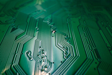 Circuit board. Technological electronic plate with roads and other components, selective focus. Technology background, electronics texture.