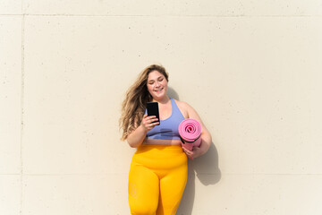 Beautiful plus size young woman training outdoors - Curvy adult female, concepts about body positive, self-acceptance, self care and fitness