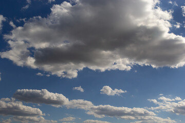 clouds in the sky lit by the sun on a summer day. background