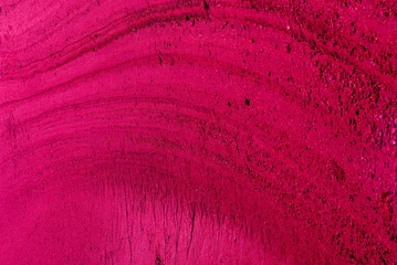 Surreal background of red, viva magenta streaks in the sand. Texture. 