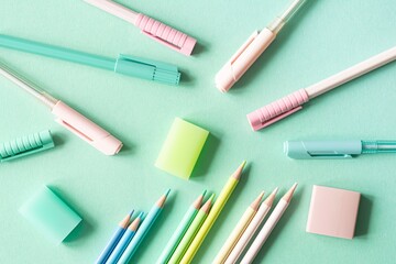 Naklejka premium Back to school, education and work concept. Stationery for learning (study) on mint background. View from above, top view. 