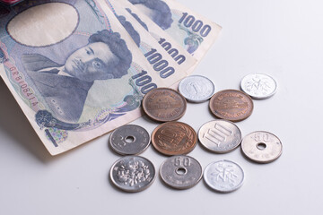 Japanese yen notes and Japanese yen coins for money concept background.Japanese Yen banknotes isolated on white background.
