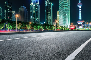 Fototapeta na wymiar Night view of road and city skyline in Shanghai