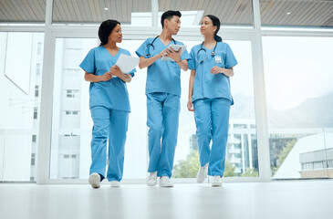 Teamwork, discussion or medical students walking or planning a surgery strategy in collaboration....