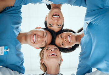 Smile, teamwork or faces of doctors in huddle laughing in collaboration together for healthcare goals. Low angle, funny team building or happy medical nurses with group support, motivation or mission