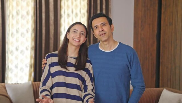 Happy Indian couple talking about their future plans