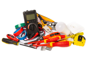 Electrician equipment isolated on white background, with copy space.Electrician tool set.Multimeter, tester,screwdrivers,cutters,duct tape,lamps,tape measure and wires.Flet lay. © Avocado_studio