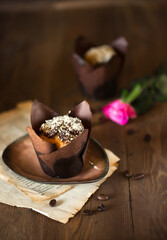 Appetizing chocolate cupcake, beautiful still life with delicious cake on the table. Sweet delicacy berry pudding in a candy store. beautiful food