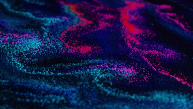 Abstract Macro Slow Motion Shot of Multicolored Particles Fluid isolated on black. Fluid art drawing video flowing effect. Ink swirling. Liquid paint mixing artwork. Depth of field. 3d animation 4K