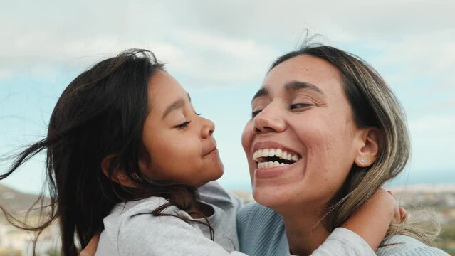 Happy Joyful Latin mother with her little daughter at house rooftop 
