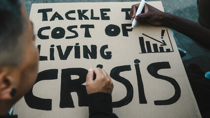 Activists preparing protest banners against financial crisis and global inflation