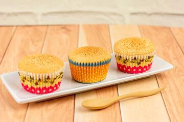 Homemade Japanese sponge cake, and castella cake on a wooden table. Delicious dessert..