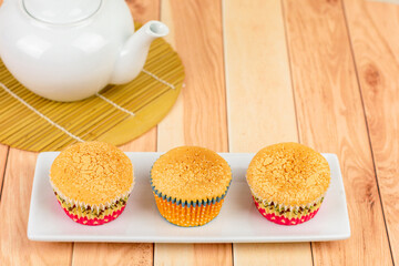 Homemade Japanese sponge cake, and castella cake on a wooden table. Delicious dessert..