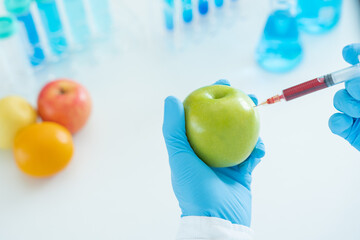 Scientist check chemical food residues in laboratory. Control experts inspect quality of fruit,...