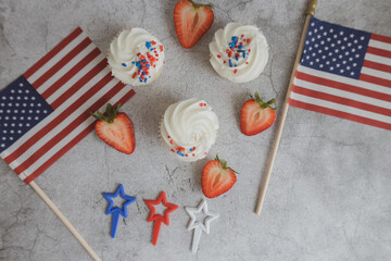 Cupcakes on the beautiful table. Healthy breakfast. Strawberry on cupcakes. American flag. Independence Day 4th of July.