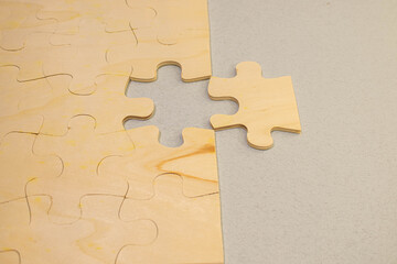 Puzzle jigsaw on orange background. business concept