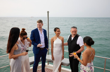 Fototapeta group of friends having fun and party celebrating on luxury yacht obraz