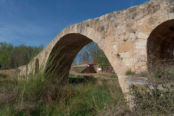 roman bridge in perspective, railway bridge in the background