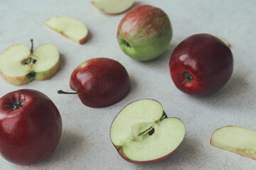 Summer fruit composition made of red apples close up on pastel background. Healthy food concept.