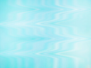 The background consists of blurry wave patterns with a light turquoise color