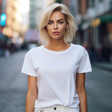Woman wearing plain white t-shirt on street in evening. Mockup for t-shirt print