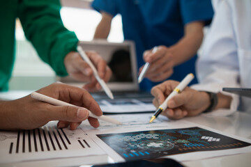 concept of mobilizing ability of medical team in conference room to diagnose and treat disease correctly. medical team joins meeting and discusses  patient illness in order to treat it correctly