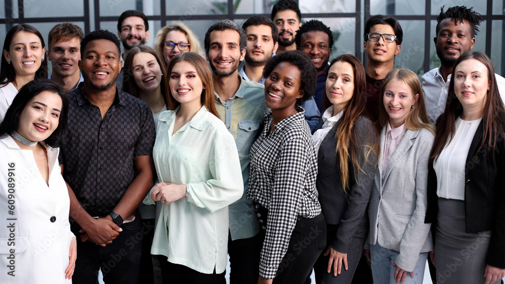 Wall mural Large Group of people standing together in studio