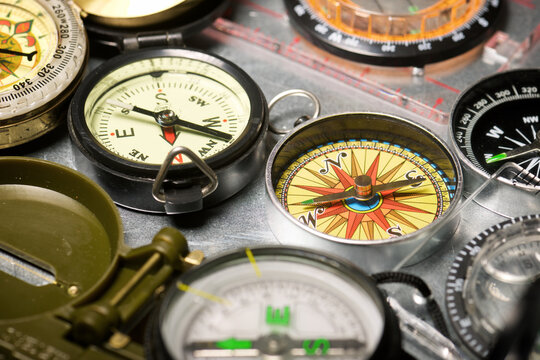 Close-up of a group of compasses