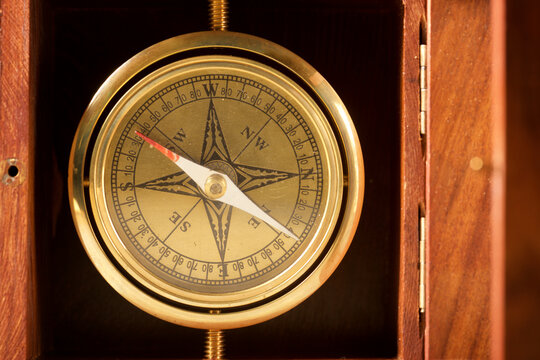 Close-up of a vintage marine navigational compass