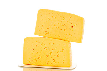 Two pieces of cheese on a white paper plate, macro, isolated on a white background.