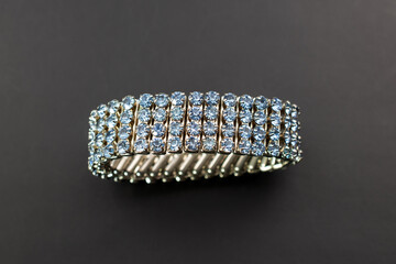 Blue rhinestone bracelet, unique vintage jewelry background, bold jewelry concept, promotional photo for an online jewellery store