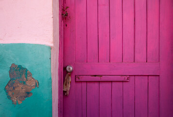 Closeup of colorful, old, weathered door in Isla Mujeres, Mexico
