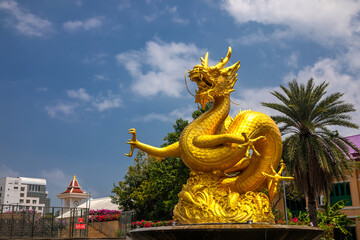 Fototapeta na wymiar Monument to the golden dragon on the island of Phuket in Thailand