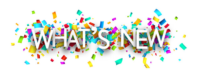 What's new sign over cut out ribbon confetti background.
