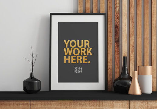 Vertical black Poster Art Frame Mockup with passepartout on commode