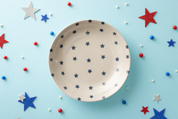 Fototapeta Make your table center of attention on Independence Day! From top view, array of patriotic accessories: plate, round sprinkles, glitter stars on pastel blue surface. Customizable space for text or ads obraz
