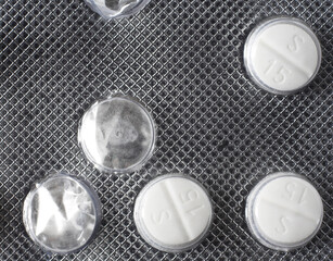 A table bubble pack with three tablets remaining