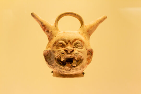 Bogota, Colombia, 02 06 2022 : Pre-Columbian stone artifact (mask) on display in the museo del oro. The museum of gold is located in Bogota, Colombia.