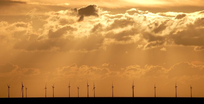 offshore windfarm at sunset