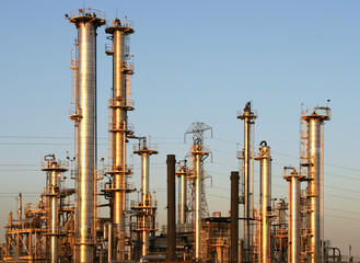 The towers and piples of an oil refinery.