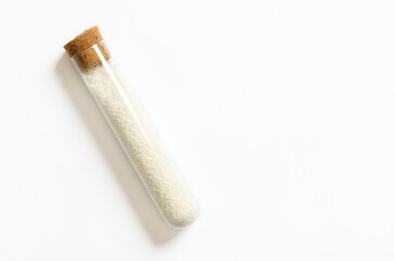 Coarse salt in a glass container with copy space.