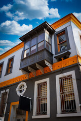Renovated greek house with orange decor and bay window in Alsancak, İzmir